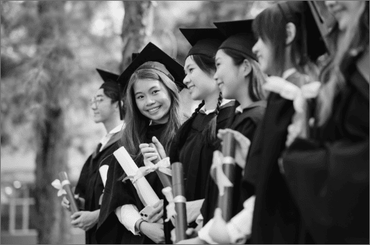 Asian Chinese graduation girl looking at camera.